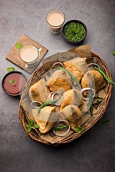 SamosaÂ Snack is an Indian deep fried pastry with a spiced filling usually made with potatoes, spices and herb